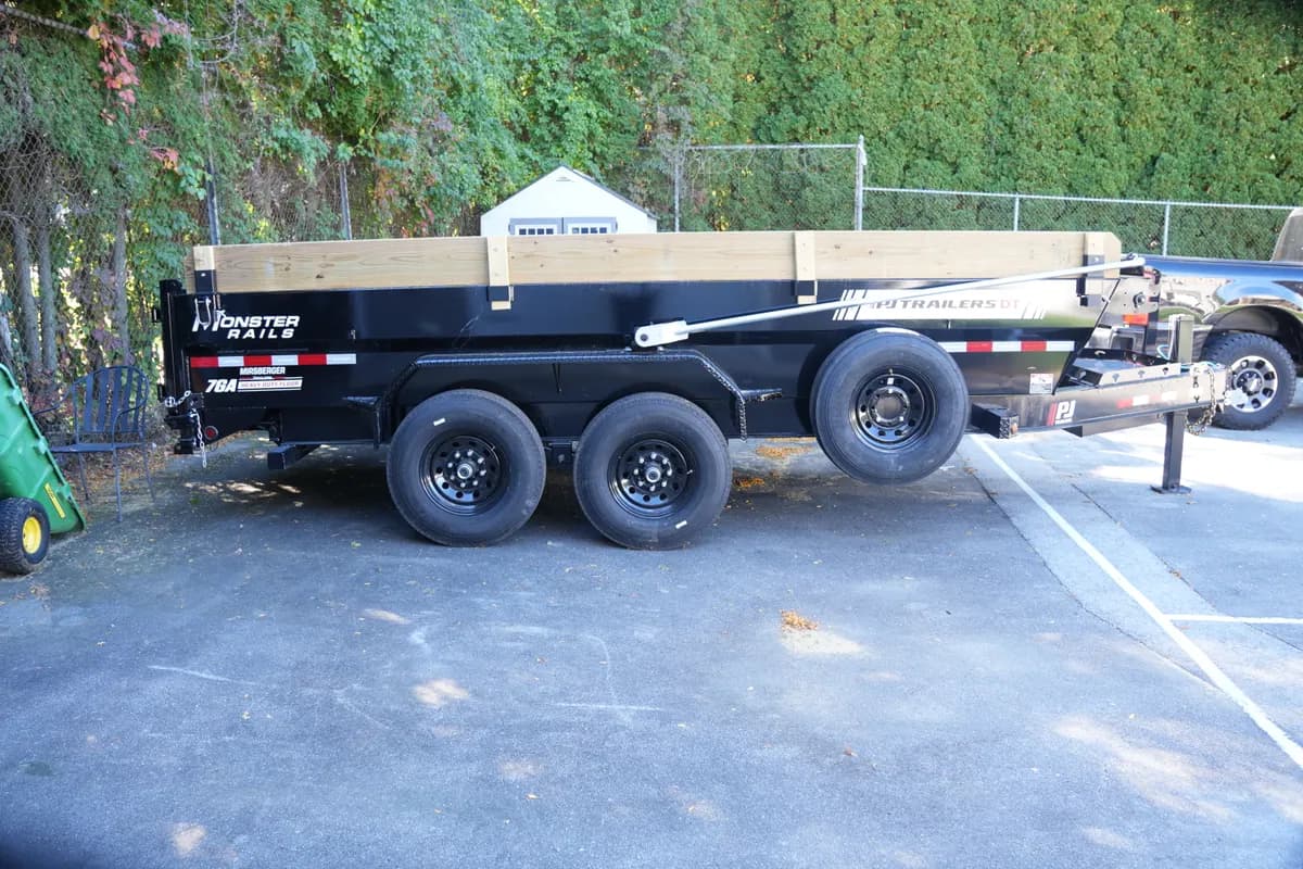 2026 PJ DT1162 16' dump trailer, side view showing the spare tire